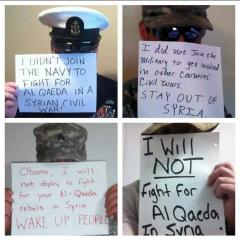 Military Men Hold Signs Refusing To Fight For Al Qeada in Syria