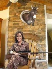At a girl Sarah Palin Donkey Head Trophy Over the Fireplace