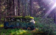 a van left out in the woods