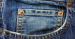 What is the small pocket above the normal pocket on blue jeans for?