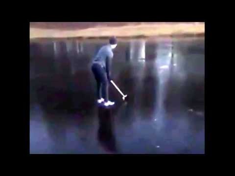 Golfer falls into frozen over lake.