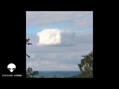 A perfect cube shaped cloud (Borg) filmed in the UK &amp; plane with banner frozen in mid air..