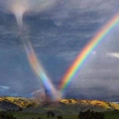 Rare photo - Tornado sucks in a bright rainbow