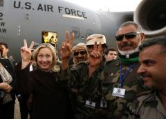 Hillary Clinton making peace sign with Libyan Rebels