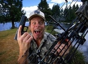 Wild man Ted Nugent with a gun and a bow