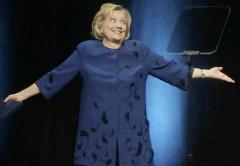 Hillary wears blue dress with little swimmers on it on anniversary of Bill&#039;s Impeachment