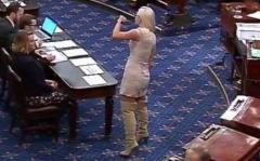 Tasteless Democrat Senator from AZ Krysten Sinema dressed like a pole dancer in the Senate