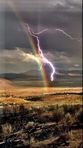 A lightning strike and a rainbow